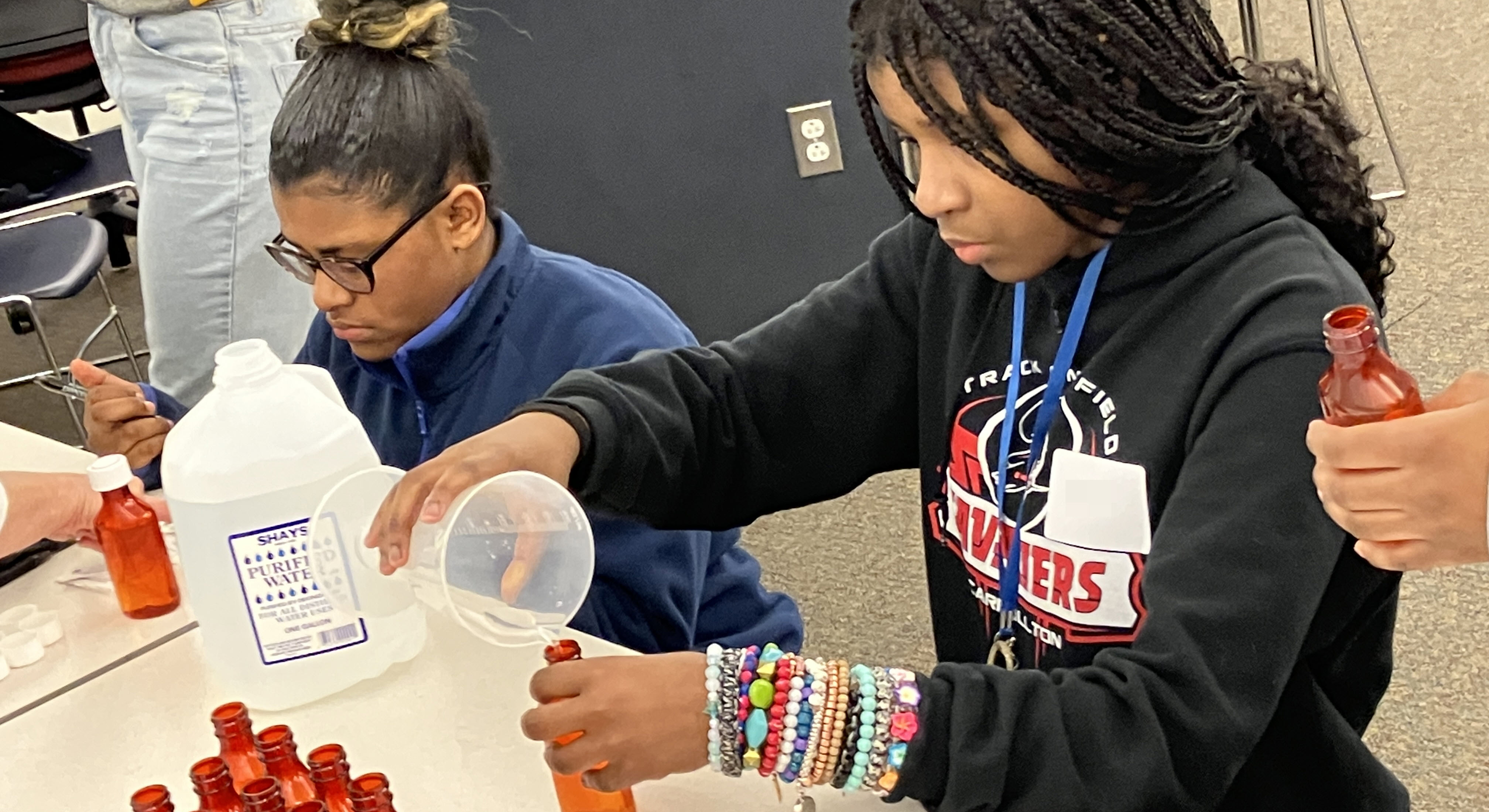 Students measuring a sugar solution.